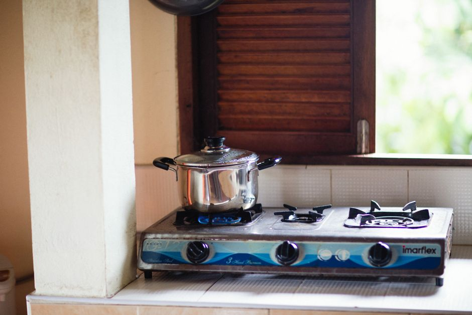 A lived-in home with a temporary kitchen setup during renovation, including small appliances and boxed supplies.