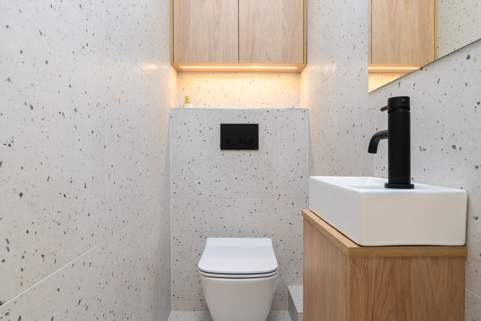 A small bathroom layout or design plan showing fixture spacing in a compact room.