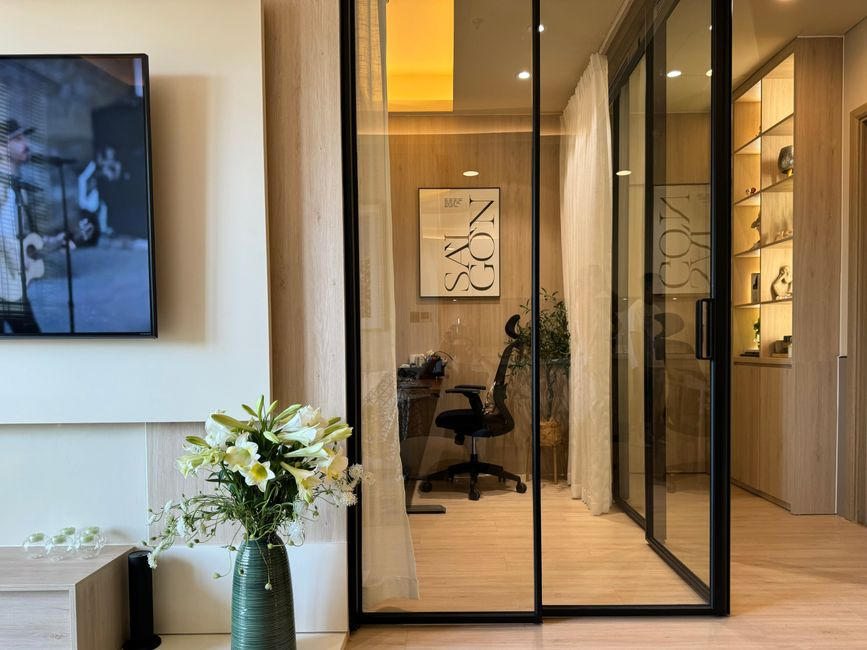 Modern office glass partition shown in an opaque frosted state for privacy.