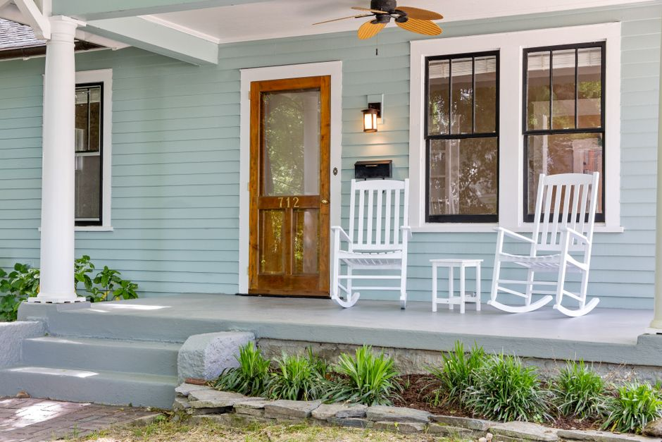 An older home exterior and inspection-related details that suggest hidden renovation issues.