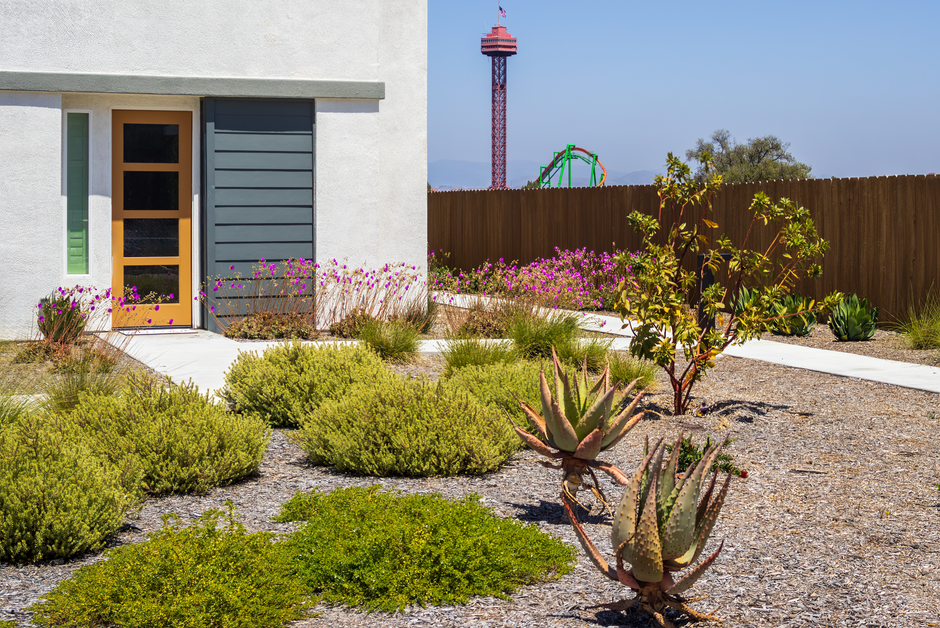 A detached backyard ADU with a clear walkway and separation from the main house.