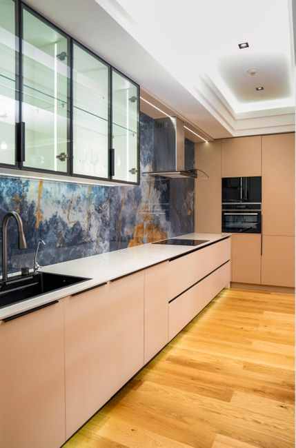 A bright remodeled Los Angeles kitchen opened to adjacent living space.