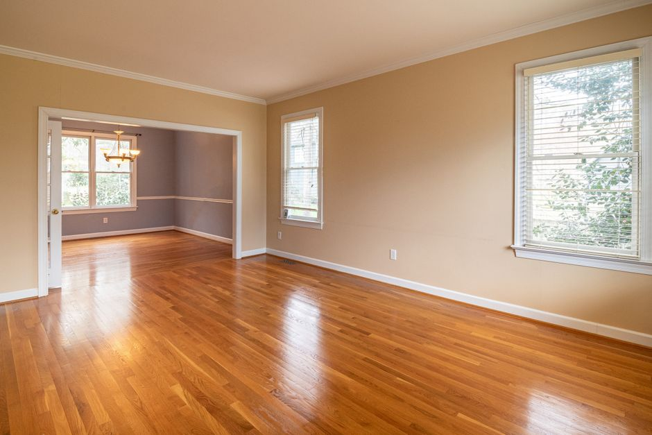 Sunlight coming through large replacement windows in a bright residential room.