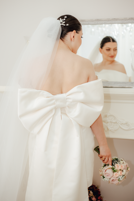 Wedding gown detail featuring crisp organza layers with visible shape and airy structure.