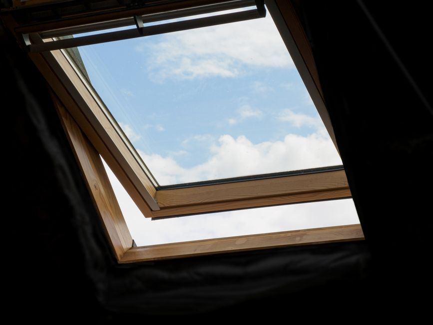 Attic space with roof vents visible, showing the ventilation path beneath the roof.