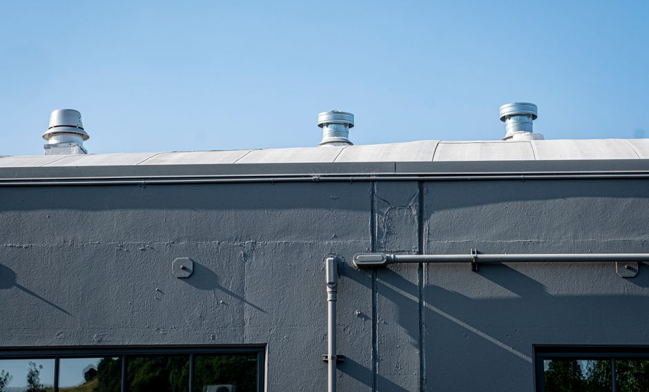 Exterior view of a roof skylight with surrounding flashing details visible.