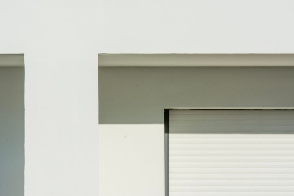 Close-up of common home entry areas such as a garage door seal and exterior vent that may need rodent exclusion work.