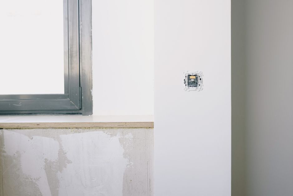 A lived-in home renovation scene showing kitchen construction and the temporary disruption of remodeling.