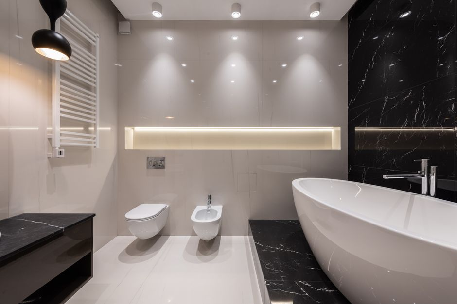 A freestanding bathtub placed in a bathroom where surrounding clearance feels limited compared with the rest of the layout.