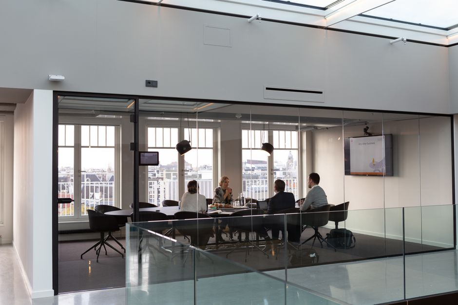 Modern office conference room with glass partitions that can provide on-demand privacy.