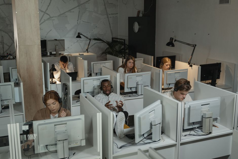 Small business staff in an office reacting to computers or payment systems going down.