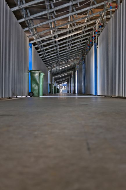 A residential garage with storage, a water heater, and visible perimeter areas that a homeowner would inspect for droppings or gaps after a storm.