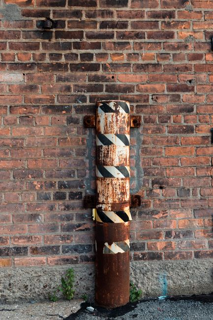 A close-up of a durable rodent-proof repair around utility penetrations and an exterior gap using gnaw-resistant materials.