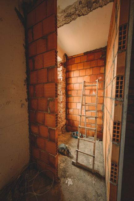 Temporary plastic barrier separating a home’s living area from an interior renovation worksite.