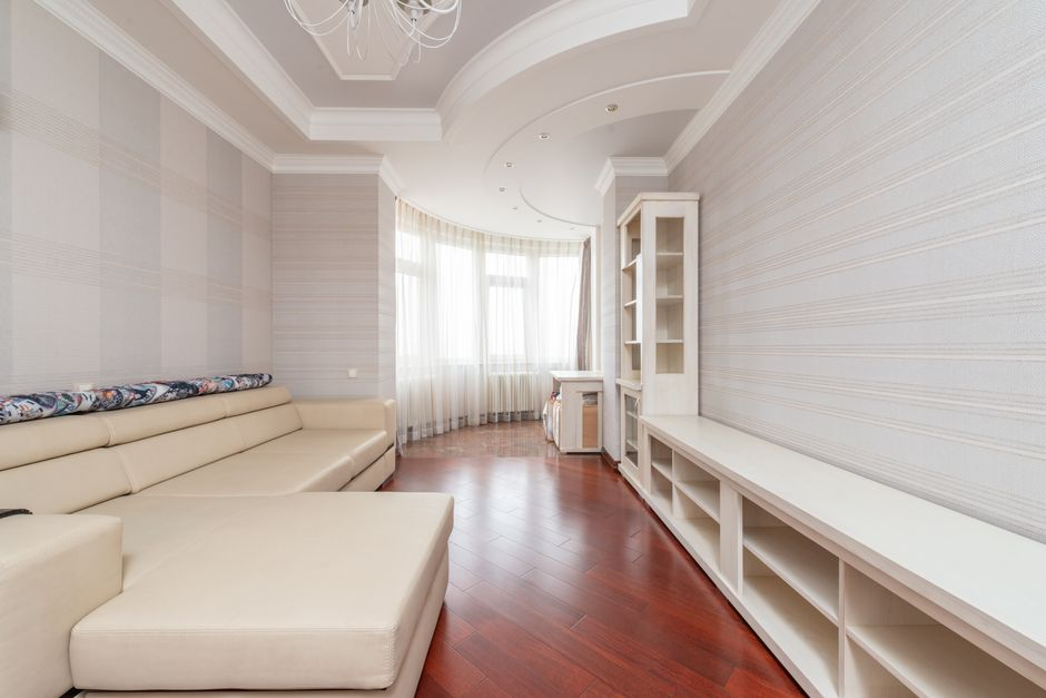 A small interior brightened by natural light from well-placed windows and doors.
