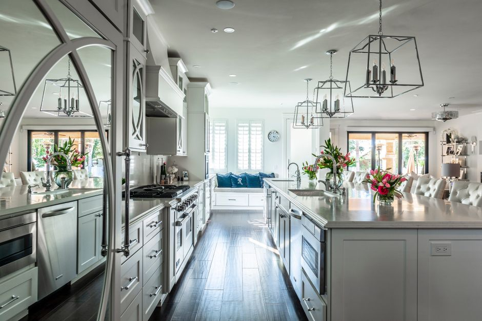 A bright open-concept kitchen and family room in a renovated California home.