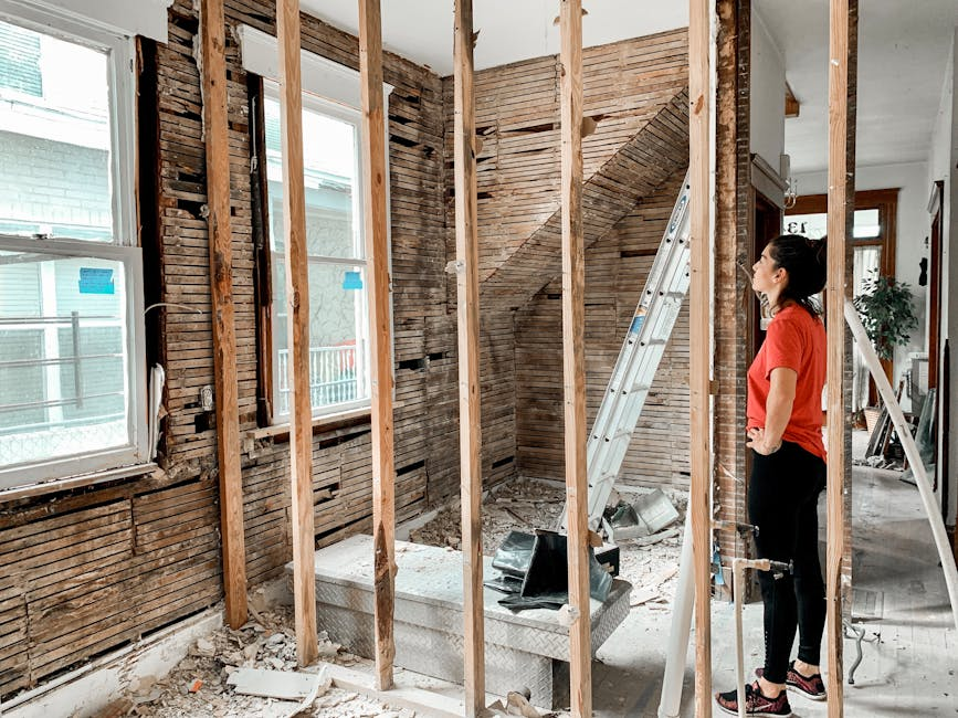 Bathroom renovation area with exposed framing and stripped finishes prepared for proper drying and reconstruction.