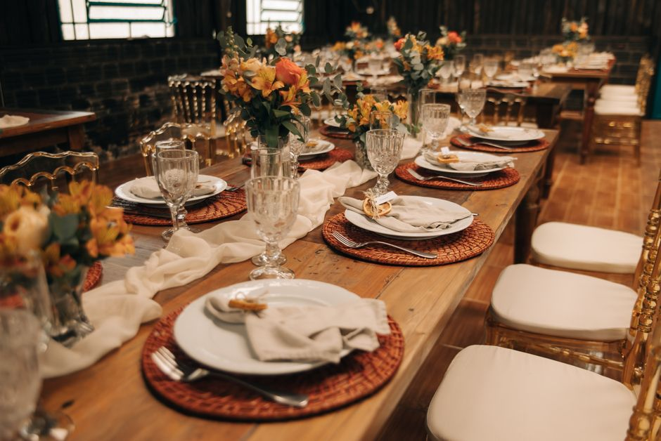 Styled event table with a polished runner and layered linens, showing sheen, structure, and wrinkle visibility up close.