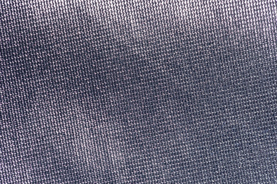 Close-up of lightweight cotton fabric showing weave openness and partial transparency.
