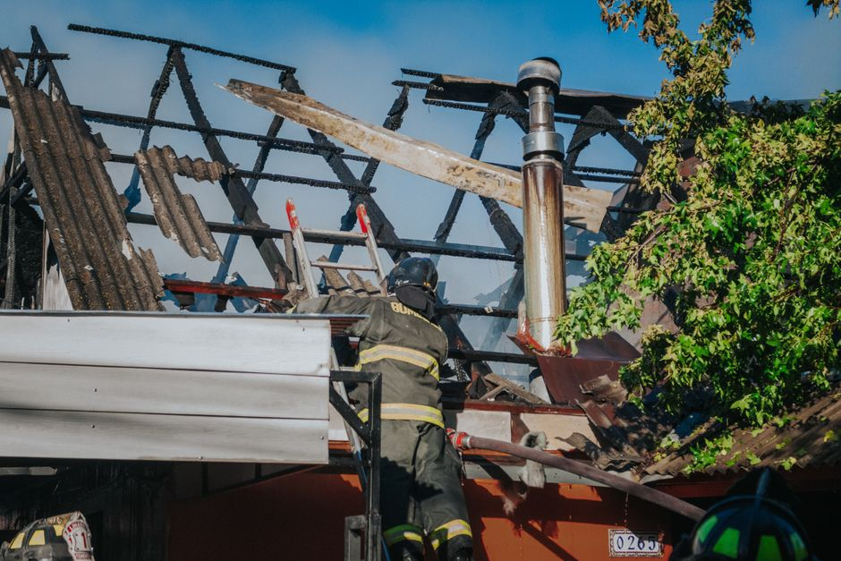Close view of a home's roof edge with aging shingles and flashing that need inspection.