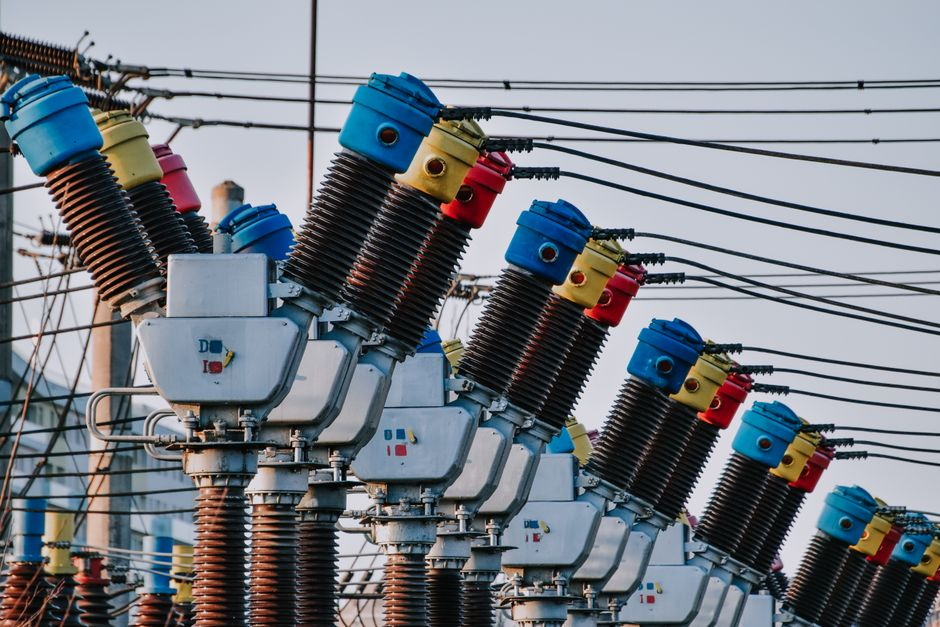 Exterior view of a utility control building within an electrical substation or industrial energy site.