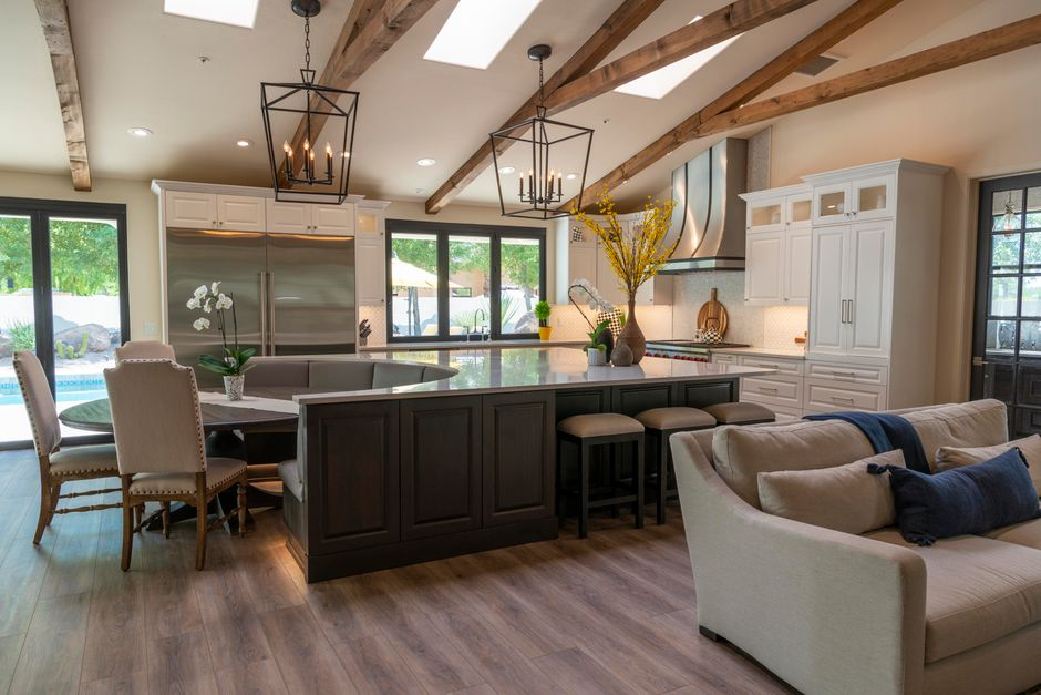 An open kitchen visually connected to nearby dining and living spaces with clear sightlines and easy movement.