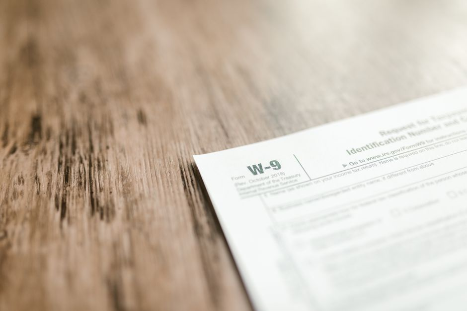 Permit and contractor paperwork related to a residential roofing project.