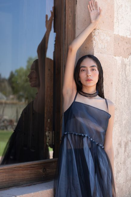 Formal dress with a structured sheer organza overlay that adds volume and lightness.
