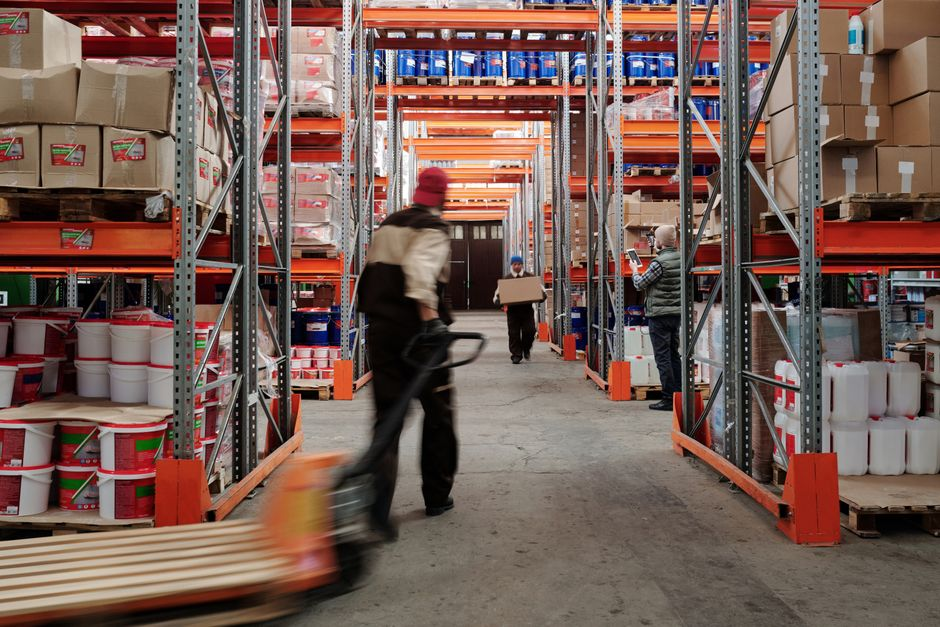 Interior of a clean industrial facility with active operations and equipment in use.