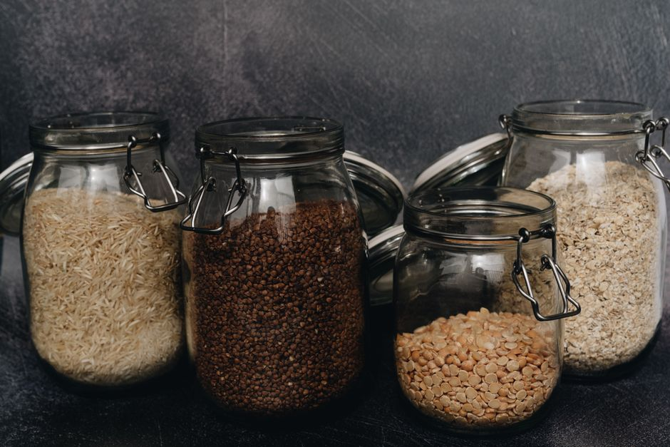 Sealed pantry containers and securely stored pet food in a tidy home storage area.