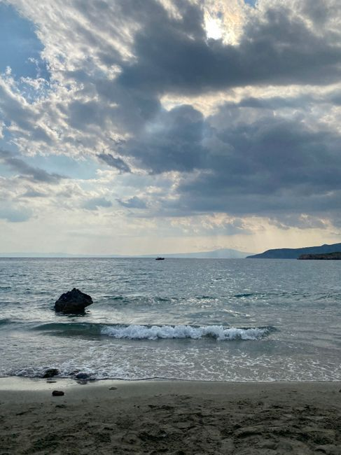 A scenic stretch of Greek coastline with rocky shore and clear water, suggesting a quieter change of scene.