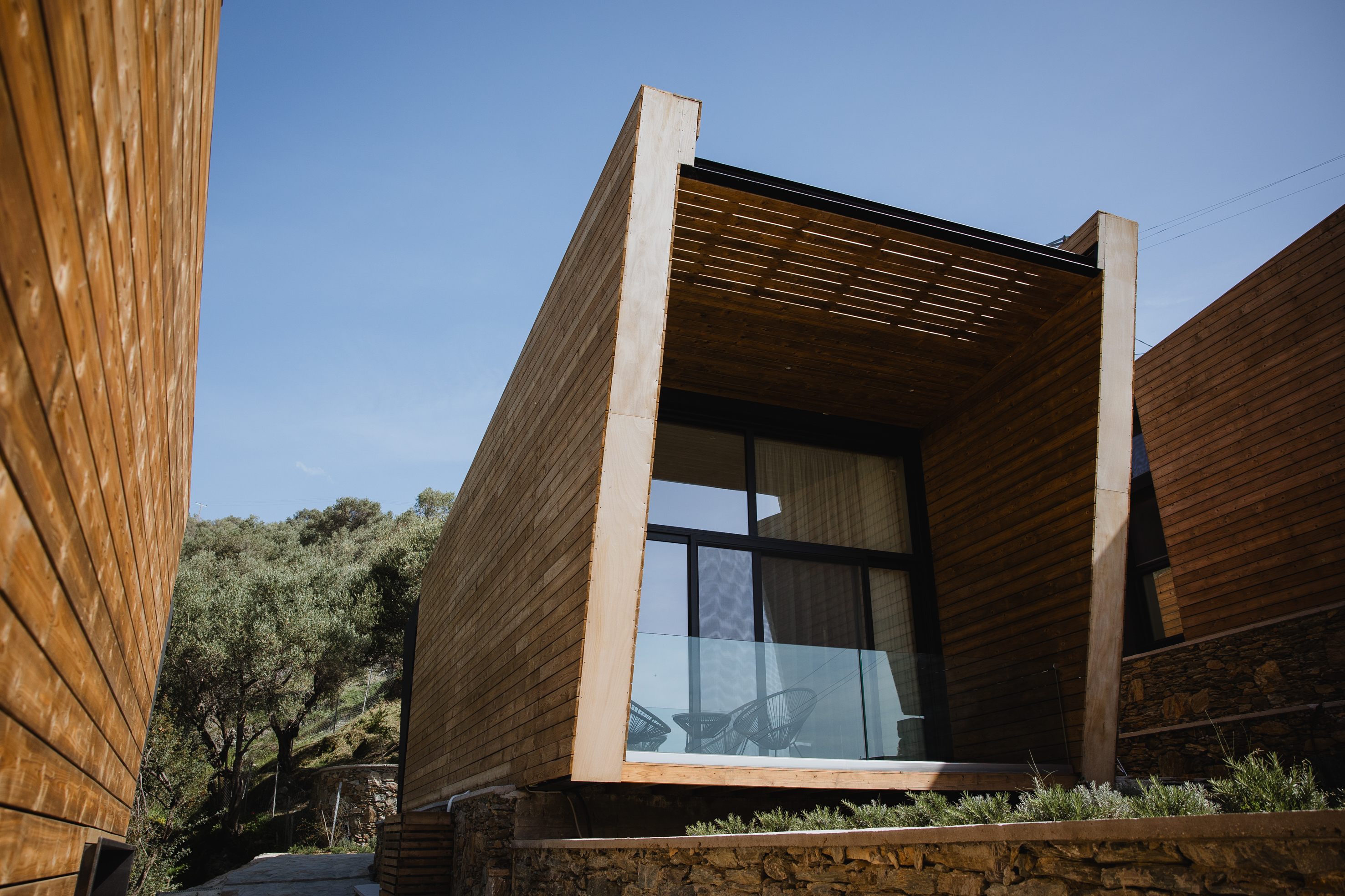 Modern architecture, wooden exterior, outdoor seating
