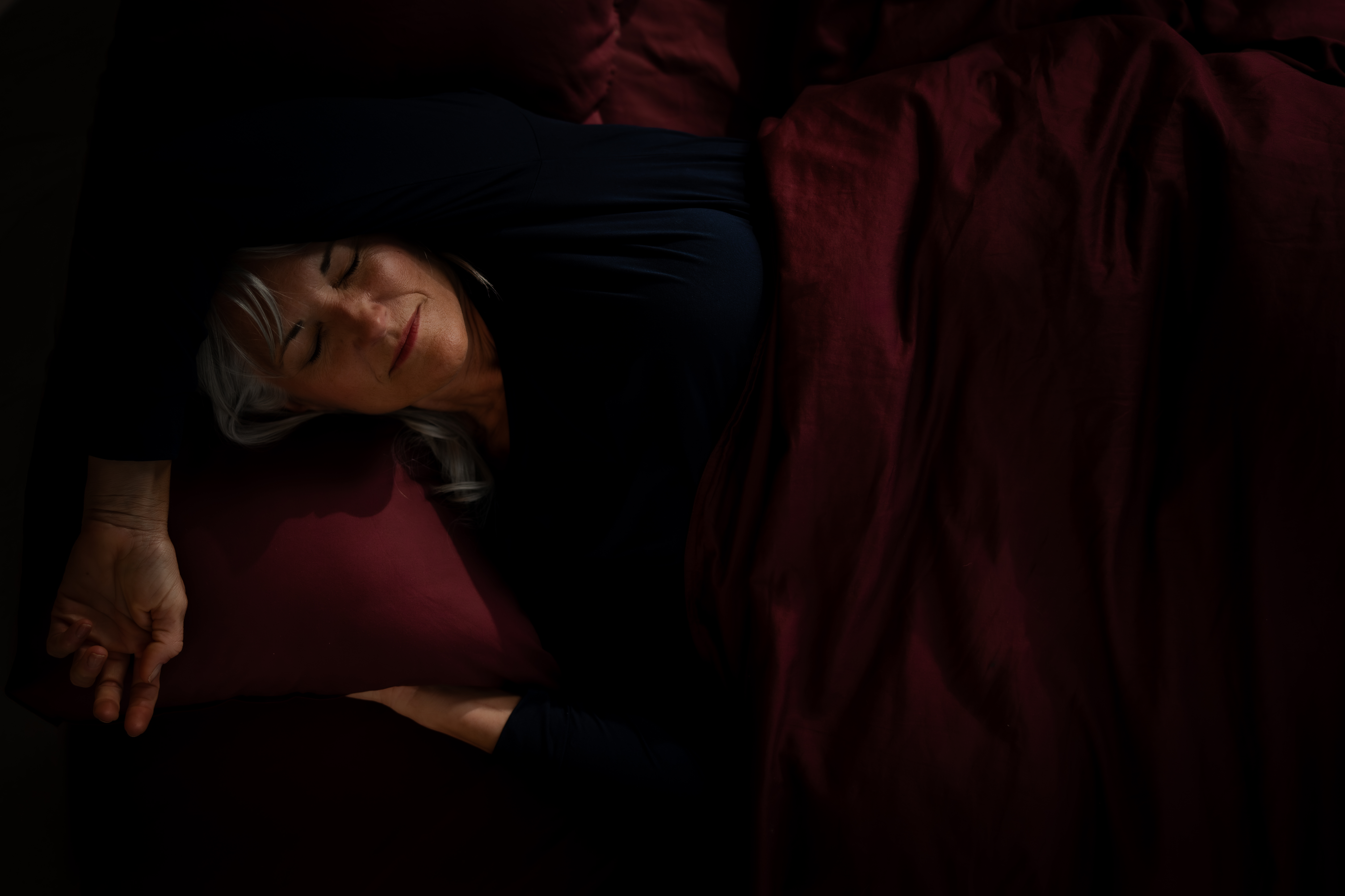 Woman sleeping comfortably on her side