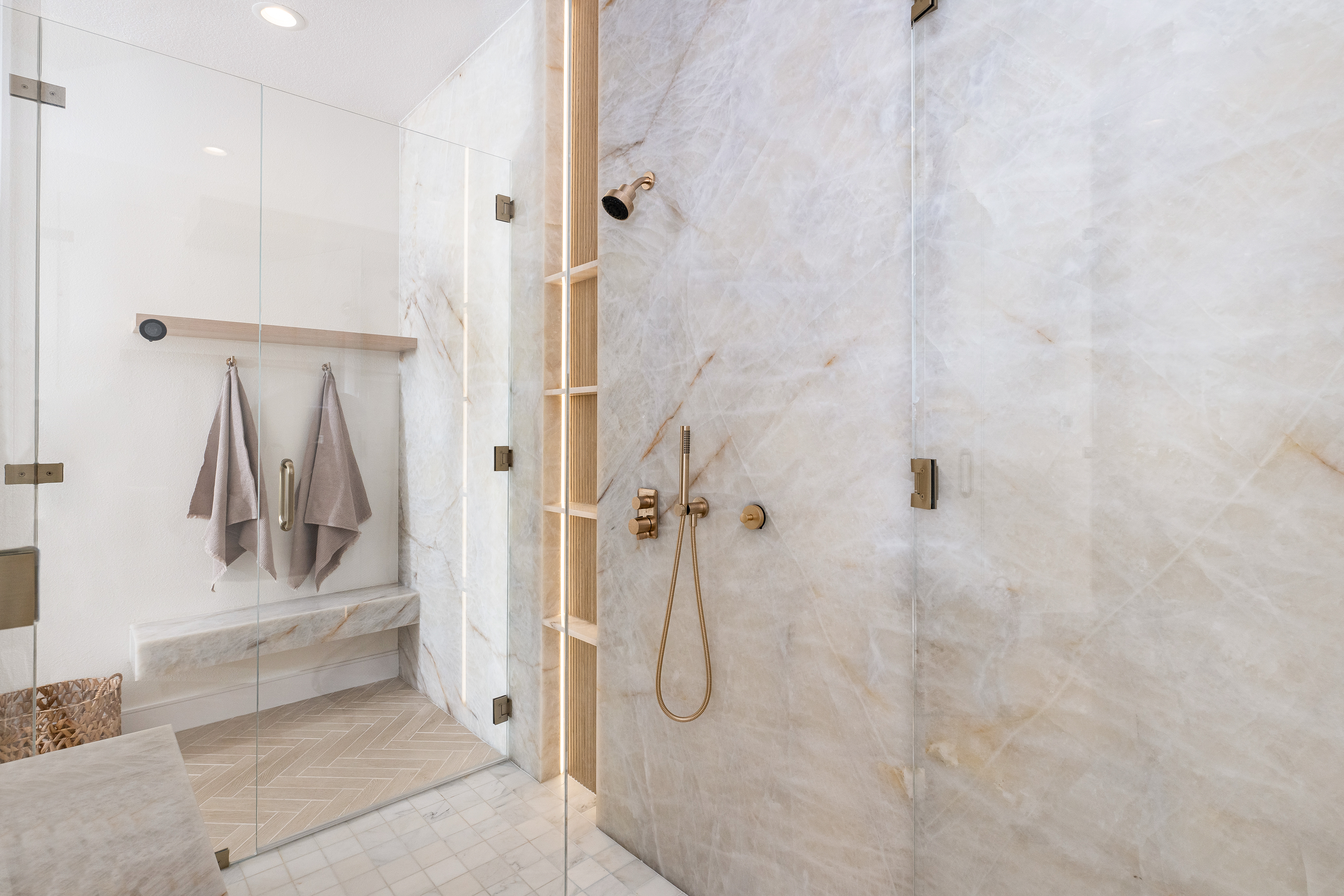 Modern bathroom, marble tiles, glass shower